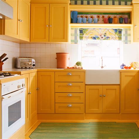 kitchen wall color yellow oak cabinets stainless steel|mustard yellow kitchen cabinets.